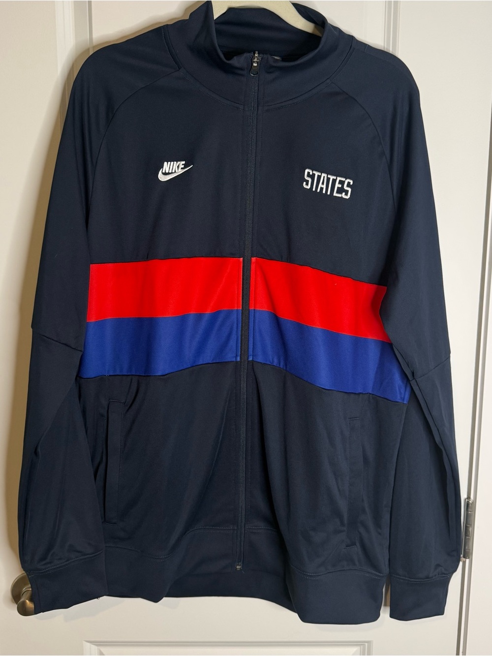 Nike Navy Performance Jacket with Red & Royal Blue Stripes